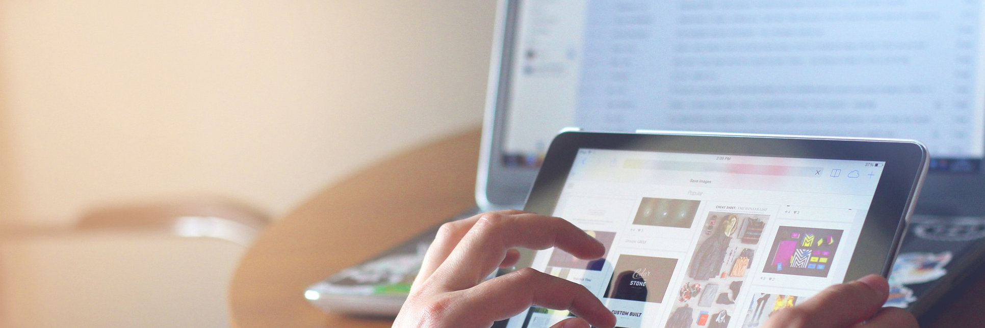 A photo of a person looking at documents on a tablet